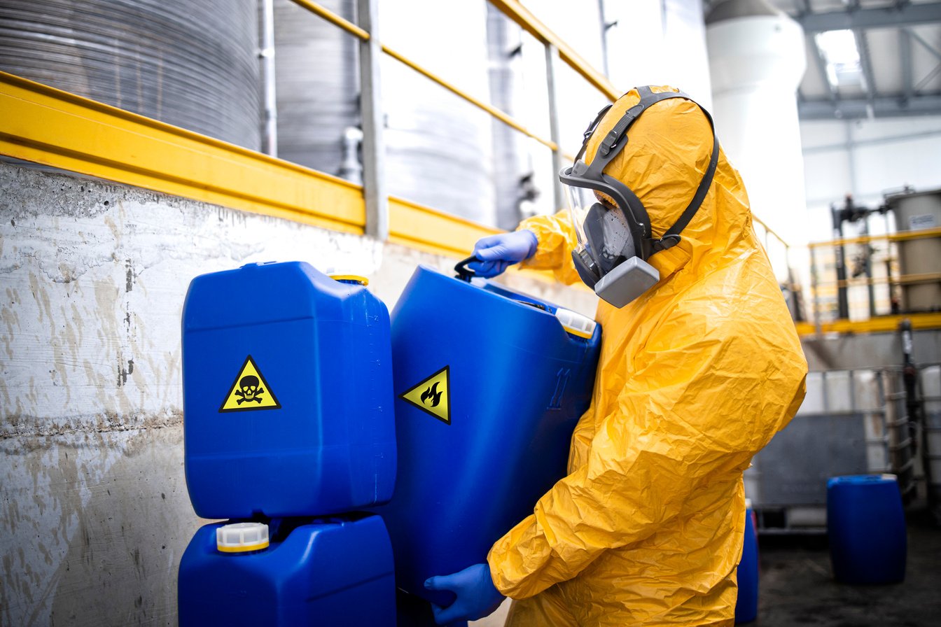 Hazardous waste and chemicals removal inside recycling plant.